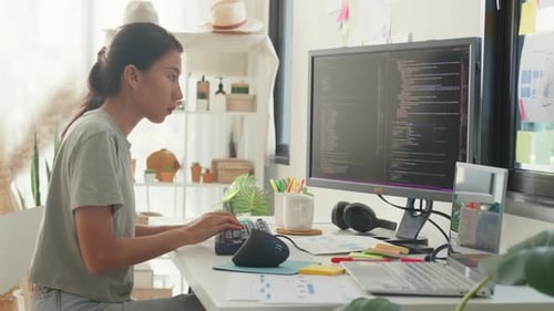 girl IT development programmer typing on keyboard coding programming fixing data code on computer.