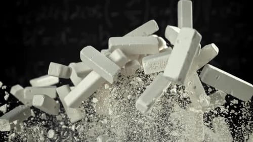 School Chalk Flies Against the Background of the Blackboard Filmed on a Highspeed Camera at 1000 Fps
