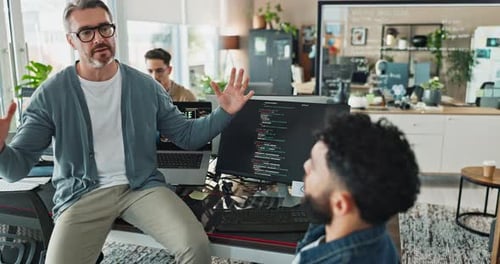 Men, talking and computer screen with coding in office for software development