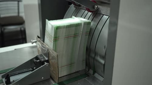 Paper Cutting Machine Processing Printed Sheets in an Industrial Printing House Concept of