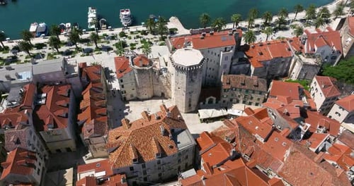 Waterfront Venetian Tower And Split Riva In Old Town Of Split In Croatia. - aerial shot