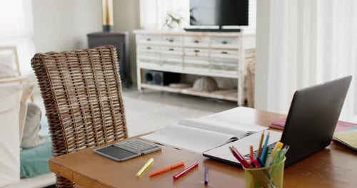 Close up of home office table with laptop, calculator and notebook, slow motion