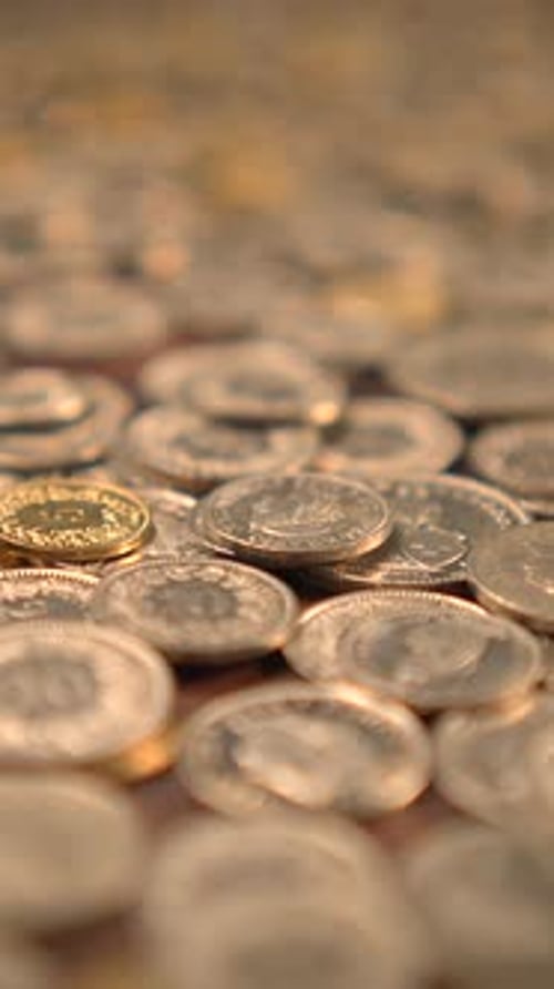 Pile of Gold and Silver Coins Macro Shot