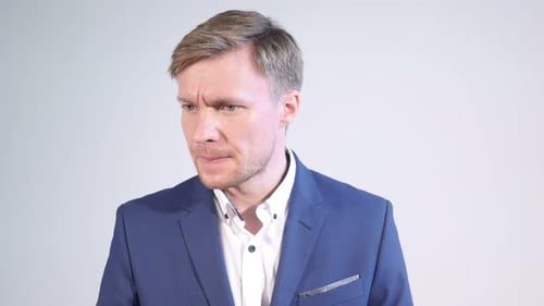 Adult Male in Blazer Ponders