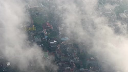 Aerial drone view of Bagansiapiapi city shrouded in morning mist