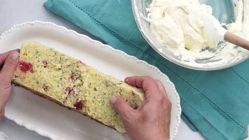 Hands Prepare Cake With Berries And Frosting