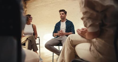 Adults Talking in Workplace Meeting