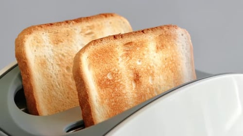 Perfectly Toasted Bread Popping Up From Toaster