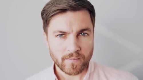 Man Applying Makeup with Sponge Close Up