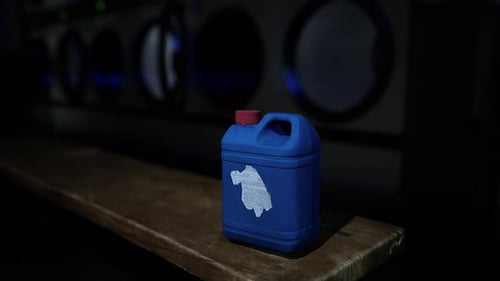 A Blue Plastic Container with a White Logo on It