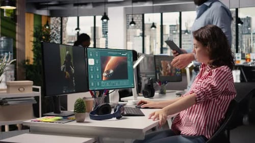 Two Colleagues Waiting for AI Text to Video Generating on Computer