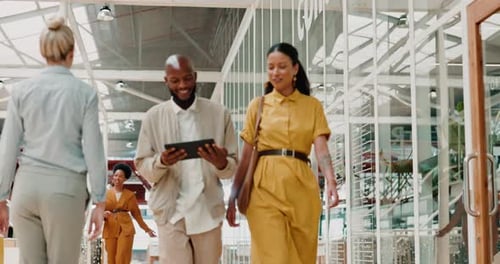 Planning, tablet and business team walking in discussion for a corporate project in office