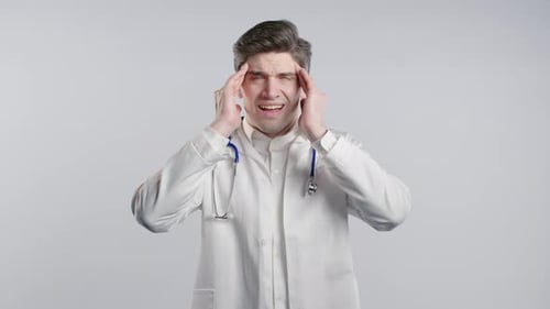 Doctor Suffering From a Severe Headache