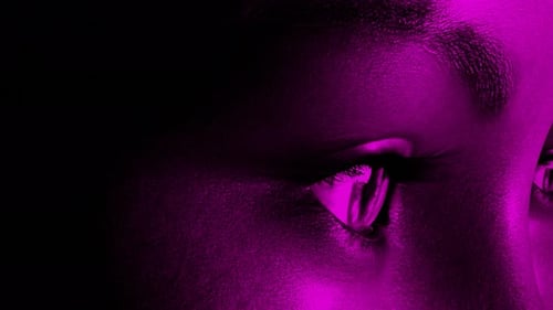 Dynamic Neon Color Lighting on Abstract Human Eyes