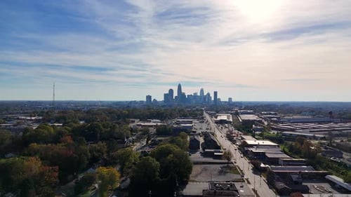 Aerial View Shows a Vibrant Sunny City Skyline with Dynamic Architecture