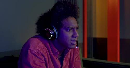 Excited Young Man Plays Video Game on Console