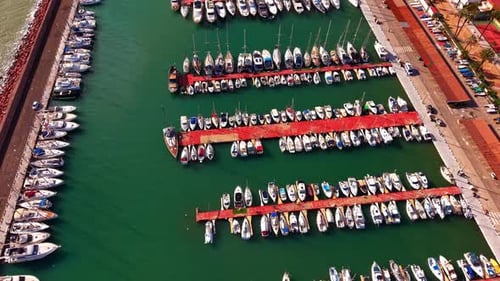 Elevated view of many sailing boats in mediterranean sea port.