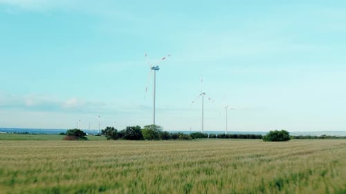 Aerial view of wind power, windmill, energy production, eco-energy in a beautiful nature.
