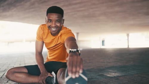 Young Man Stretches Leg Before Workout