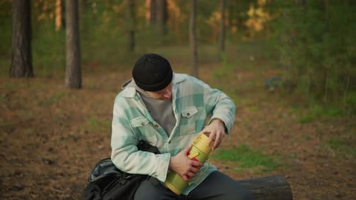 Relaxed Forest Picnic with Hot Beverage Peaceful Woodland Break with Steaming Drink and Friends