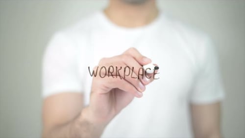 Man Writing Workplace on Clear Glass Surface