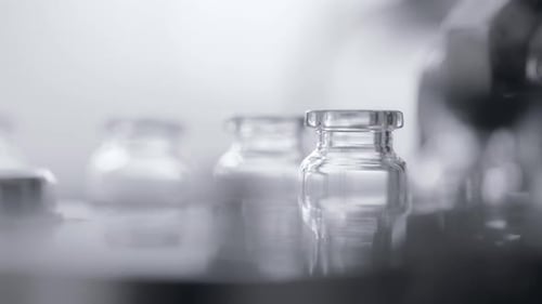 Pharmaceutical factory production line sealing liquid medication in sterile vials