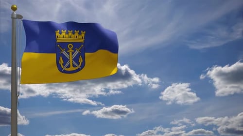 Realistic Waving Flag with Coat of Arms Against a Blue Sky
