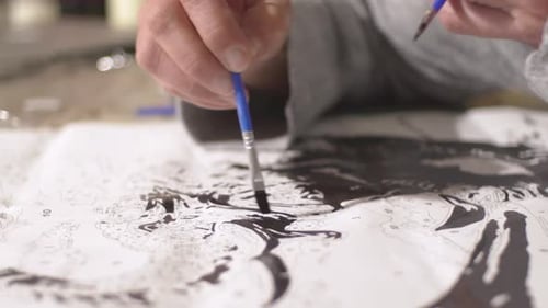 Caucasian woman painting on white canvas, painting by numbers method 4K. Close up on brush painting