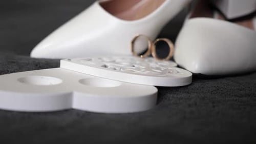 Wedding Rings on White Heels for Romantic Event