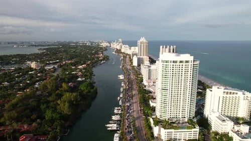 Side pan over Miami Beach. 4K aerial clip. Fontainebleau Hotel. Yachts, resorts, beachfront hotels.