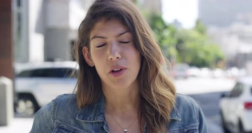 4k video footage of a young woman being interviewed about her boss on the street
