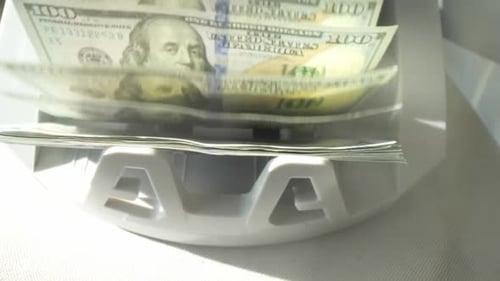 Close Up Cash Counting Machine Counting Money Banknotes of 100 Dollar Bills Money Count Machine