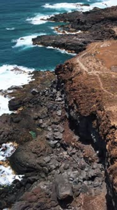 A Stunning Video of a Rocky Cliff and Breathtaking Ocean Views