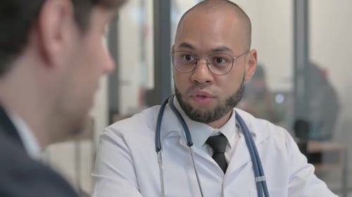 Close up of Hispanic Doctor Talking with Patient