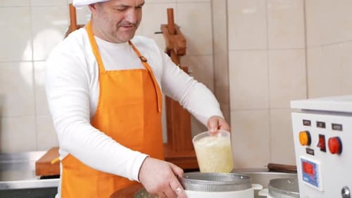 Man Makes Cheese Curd Mass Fermentation of Milk Process of Producing Homemade Cheese