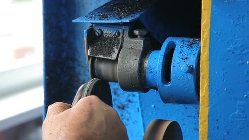 Shoe Being Shaped Using Industrial Grinding Machine