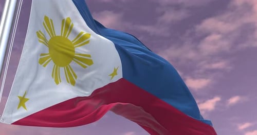 Waving Philippines Flag Against a Cloudy Sky