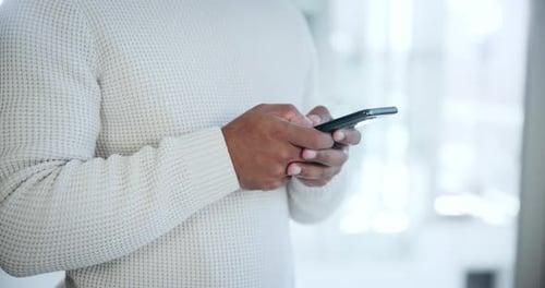 Company, office and hand on man with phone for networking, communication and typing email at work