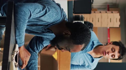 Office Workers Packing Boxes in Warehouse During Daytime