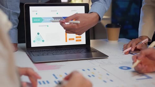 Closeup businesspeople meeting plan analysis statistics brainstorm at office night.