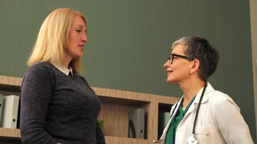 Patient Talking With Doctor in an Office Setting