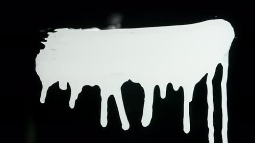White Paint Spreading on Black Background