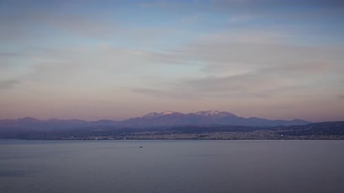 Scenic view of sea with mountains against sky