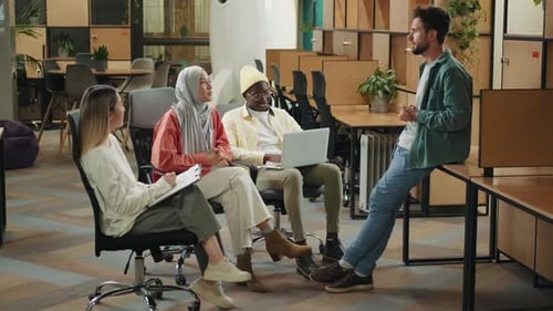 Multiethnic Business Team of Coworkers are Discussing a Project in a Modern Office