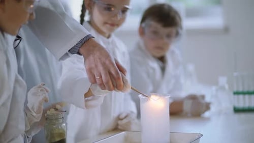 Children Observe Burning Chemical Experiment in Science Classroom