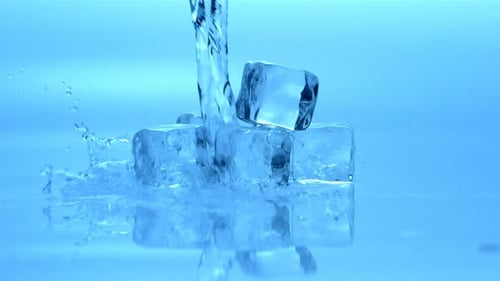 Ice cubes with water being poured on them