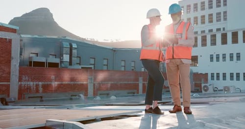 Engineer, architect and senior planning with tablet on a construction site with teamwork