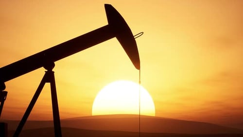 Pumpjack Operates At Sunset In Oil Field Highlighting Extraction Process