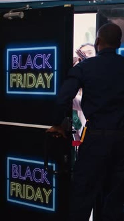 Crowd of Shoppers Pushing Through Black Friday Doorway
