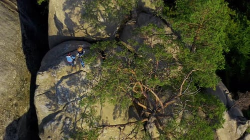 Rock Climbers Preparing Gear on Scenic Mountaintop